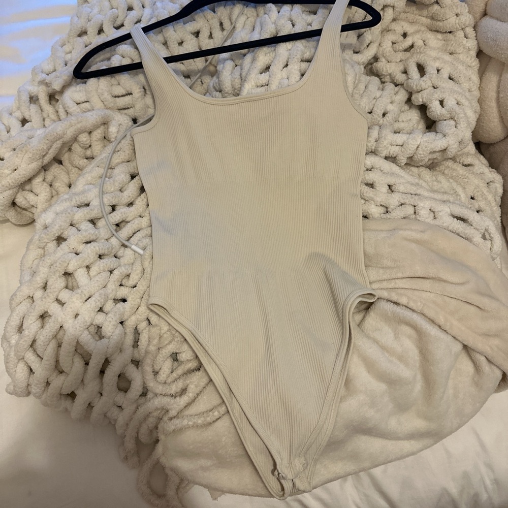 Elegant Cream Ribbed Bodysuit